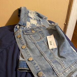 Blue denim vest with embroidery